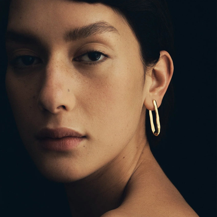 The Temple Of The Sun Sulis Studs in Gold Vermeil on a model