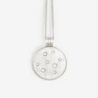 The Temple Of The Sun Nebula Necklace in Silver on a blank background