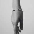 The Temple Of The Sun Venus Link Bracelet in Sterling Silver on a model in black and white
