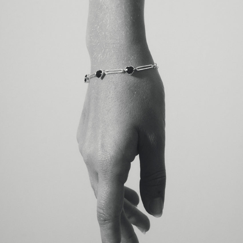The Temple Of The Sun Venus Link Bracelet in Sterling Silver on a model in black and white