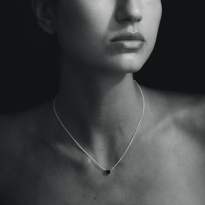 The Temple Of The Sun Venus Necklace in Sterling Silver on a model in black and white