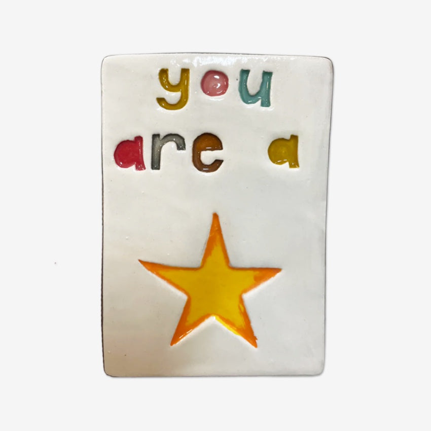 The Monster Company Large Wall Tile with You Are A Star on it on a blank background
