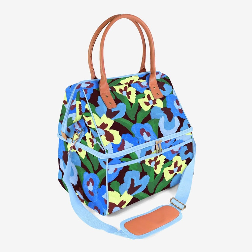 The Somewhere Co Lunch Bag in Pansy Patch on a grey background