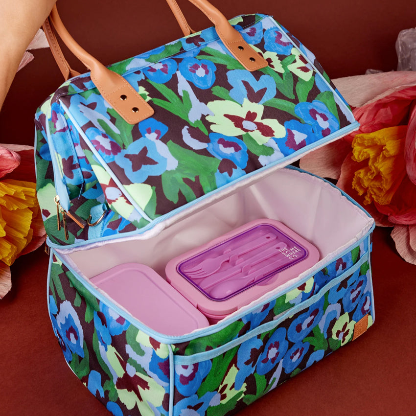 The Somewhere Co Lunch Bag in Pansy Patch being held open