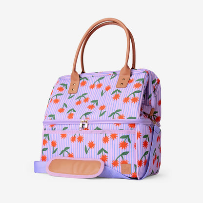 A side view of the Somewhere Co Cooler Bag in Sunburst on a grey background