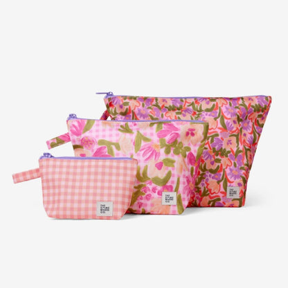 The Somewhere Co Handy Pouches in Petal Party print on a blank background
