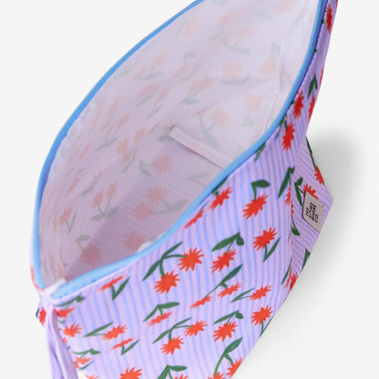 An inside view of The Somewhere Co Handy Pouches in Sunburst on a grey background