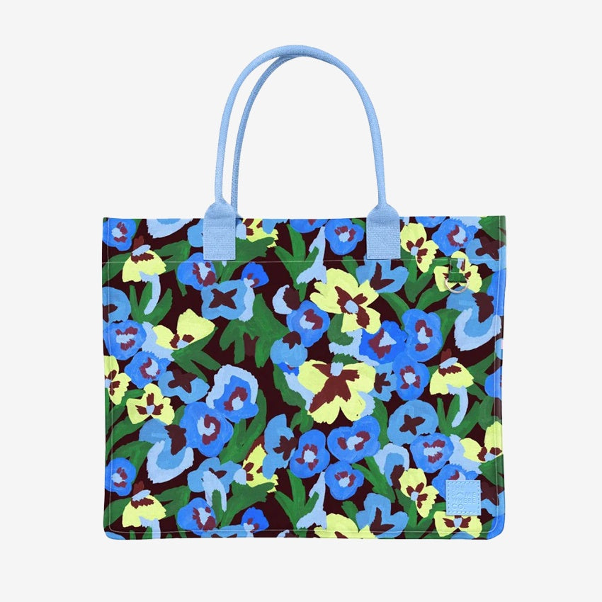 The Somewhere Co Ultimate Tote in Pansy Patch on a grey background