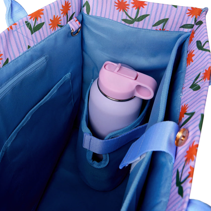 An inside view of the Somewhere Co Ultimate Tote in Sunburst with a drink bottle in it