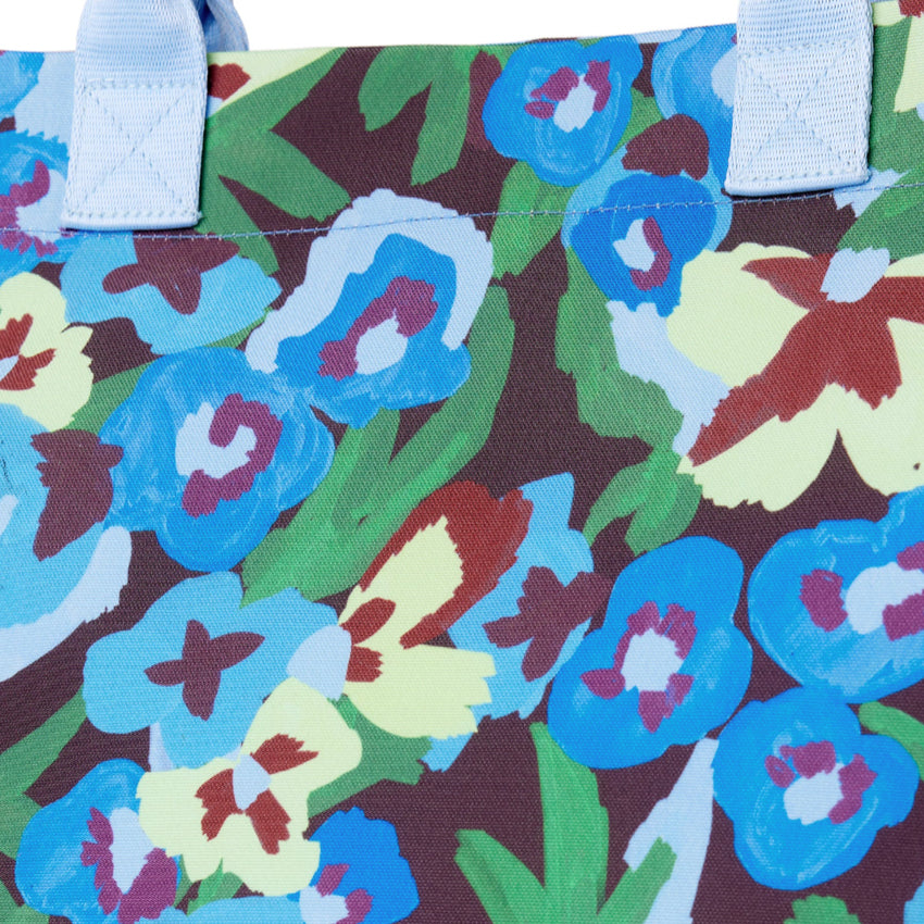 A closeup of the Somewhere Co Ultimate Tote in Pansy Patch