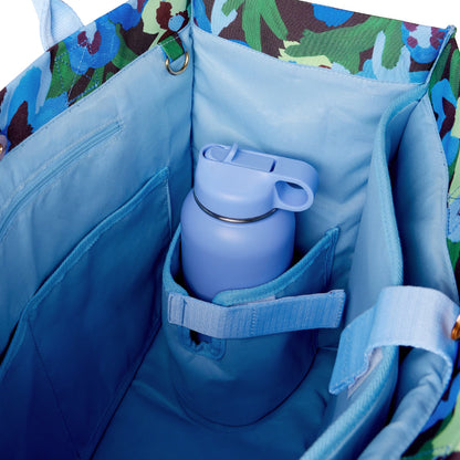 An inside view of The Somewhere Co Ultimate Tote in Pansy Patch with a bottle in it