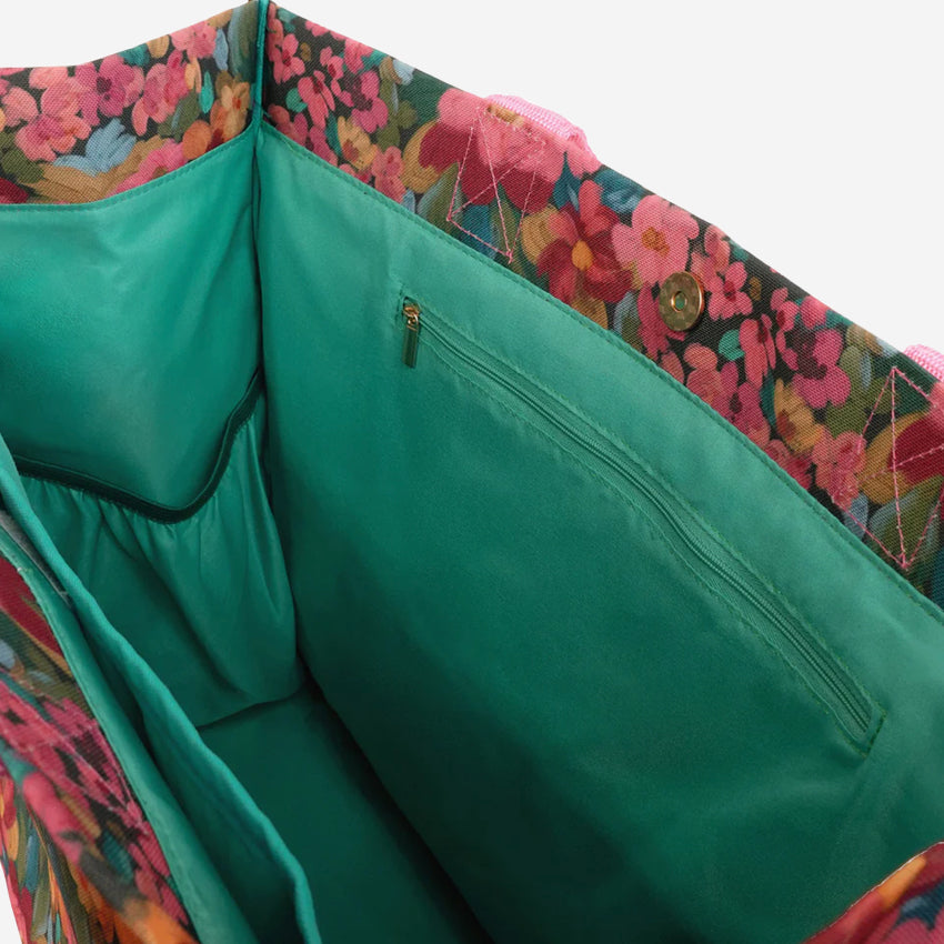 The inside view of the Somewhere Co Ultimate Tote in the Amongst the Flowers pattern.