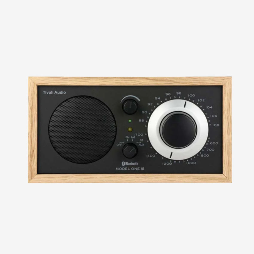 The Tivoli Audio Model One BT in Oak and Black on a blank background