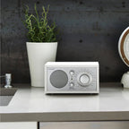 The Tivoli Model One BT in Silver and White on a kitchen bench