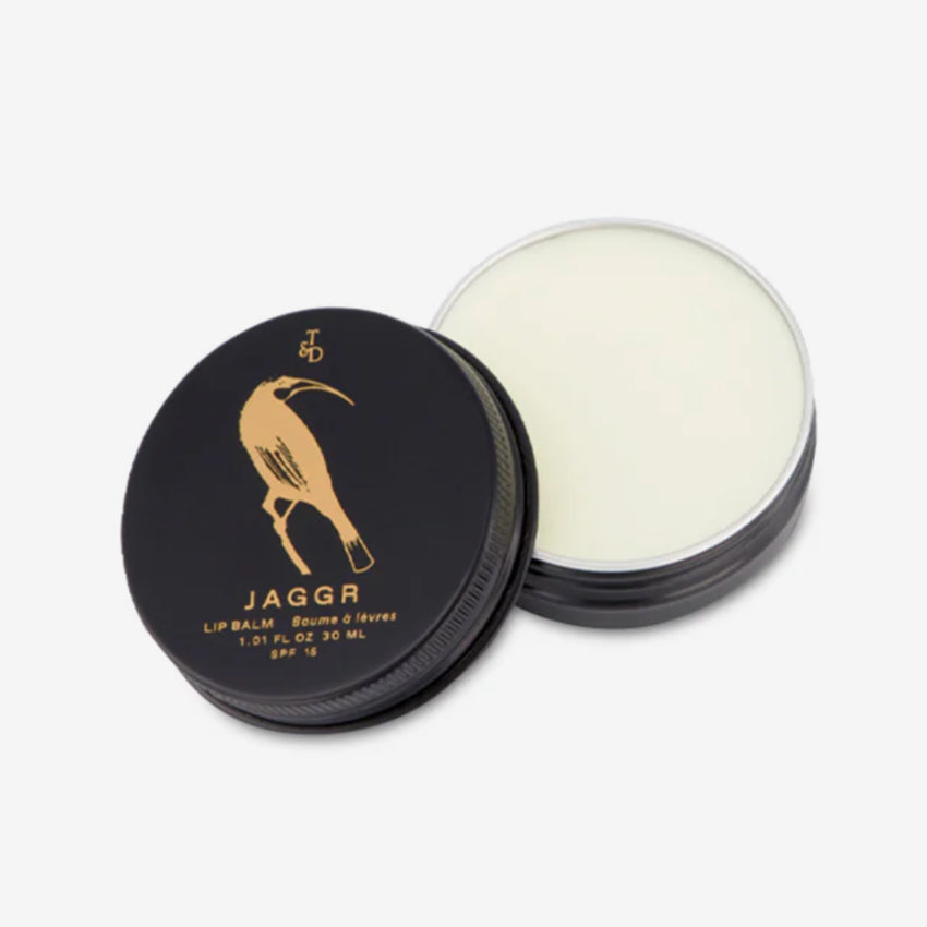 The Triumph & Disaster Jaggr Lip Balm open on a blank background