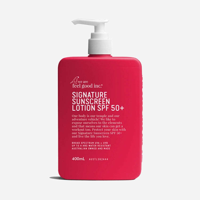 The We Are Feel Good Inc Signature SPF50+ Sunscreen Lotion 400ml on a blank background