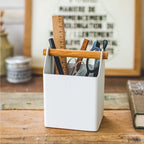 The Yamazaki Tosca Organiser in Small on a bench with rulers, scissors, bends and more in it