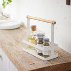 The Yamazaki Tosca Seasoning Rack on a bench with seasoning in it