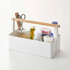 The Yamazaki Tosca Tool Box in Large on a blank background with bathroom items in it