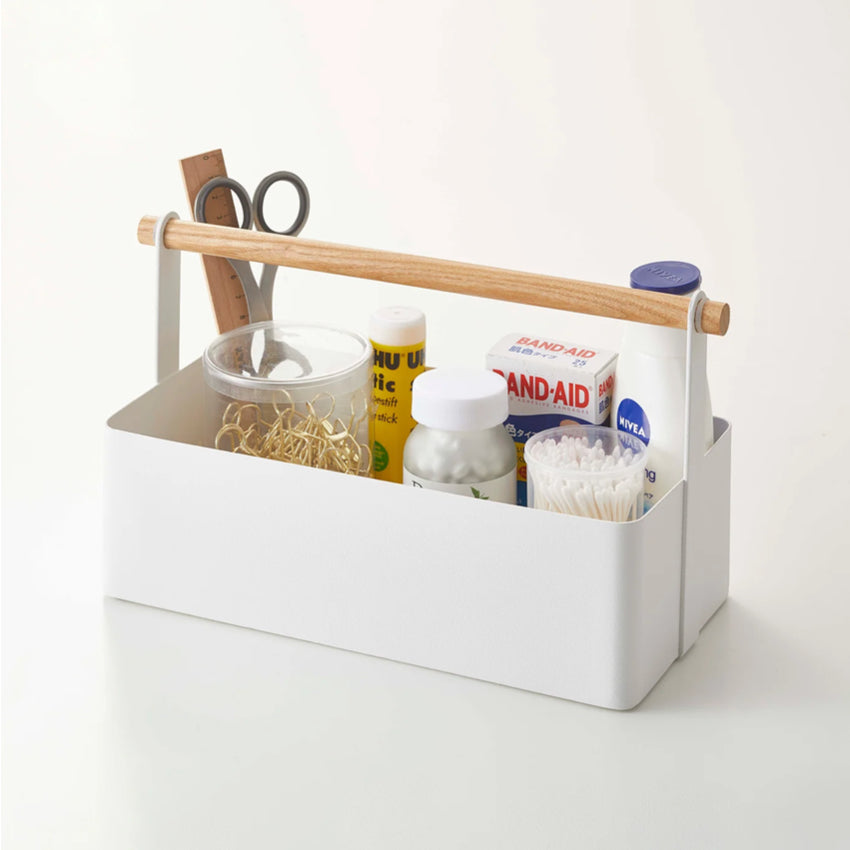 The Yamazaki Tosca Tool Box in Large on a blank background with bathroom items in it
