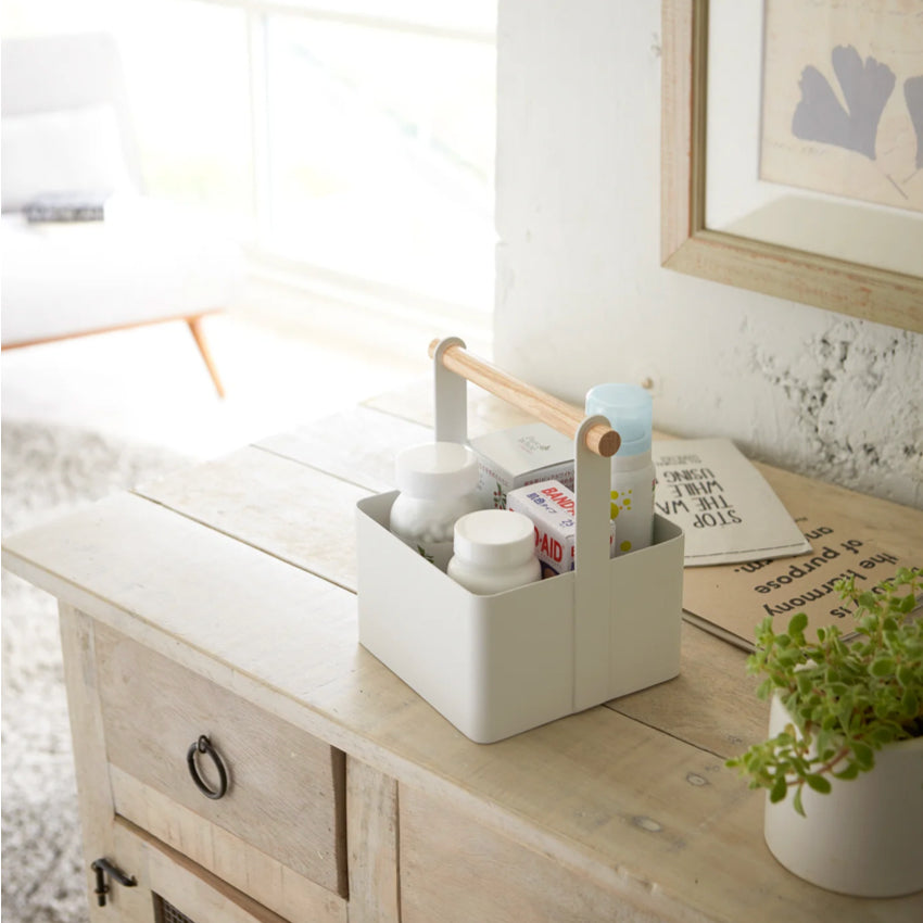 The Yamazaki Small Tosca Tool Box on a side table with medicines in it