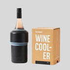 The Huski Wine Cooler in Black with a wine bottle in it and next to its box on a blank background