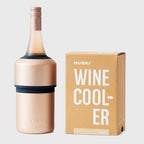 The Huski Wine Cooler in Champagne with a wine bottle in it and next to its box on a blank background