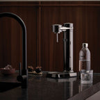 A Black Chrome Aarke Carbonator 3 on kitchen bench