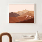 A digital art print depicting the Cardrona Valley landscape with shades of brown by Bridget Hall in a frame on a wall