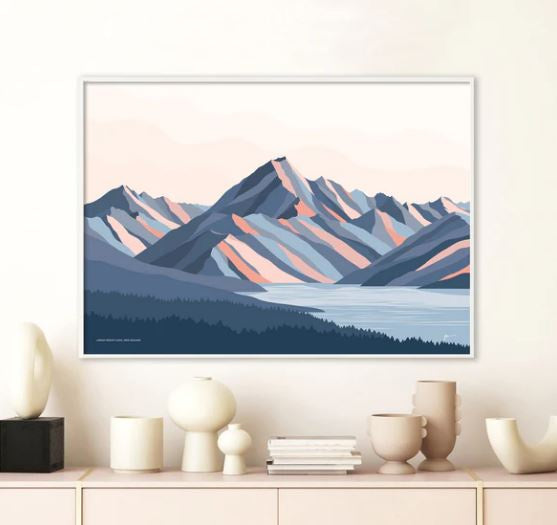 An art print of the Aoraki Mountains, in a contemporary colour palette capturing the essence of the mountain range by Bridget Hall Designs in a frame on the wall.