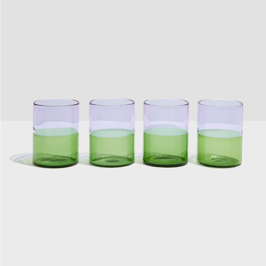 The set of four Fazeek Two Tone Glasses in Lilac and Green on a blank background