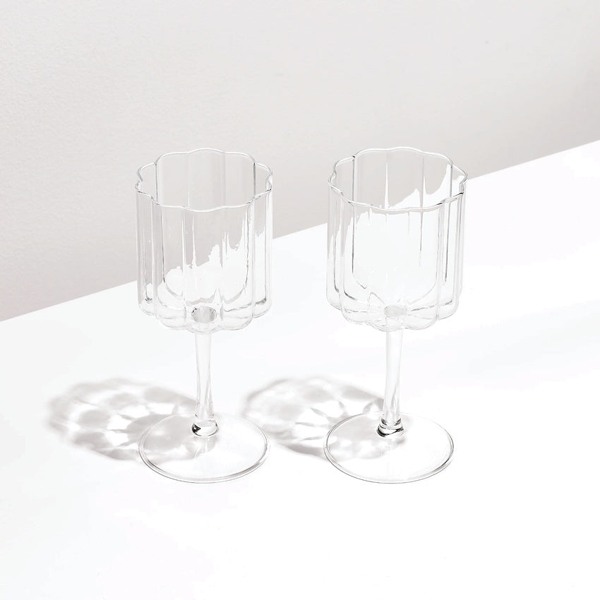 The Fazeek Wave Wine Glasses in Clear on a blank background