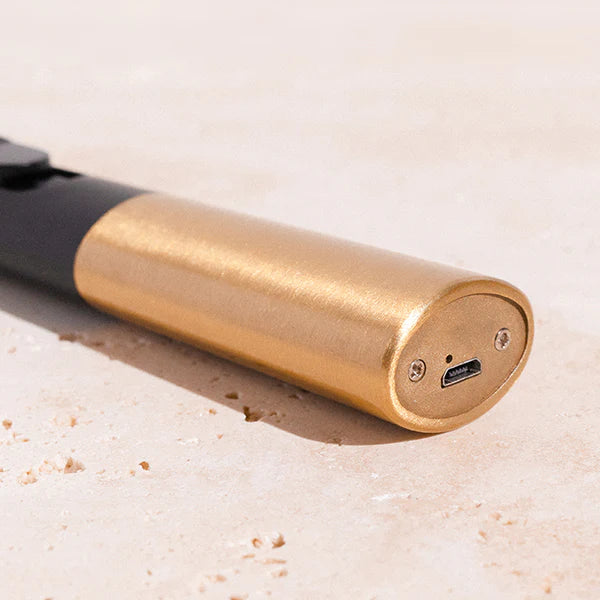 A closeup of the charging port of the Flint Rechargeable Lighter in Gold