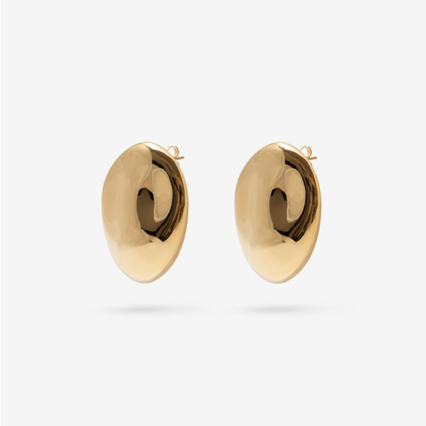 The Nina Gordon Dylan Dome Earrings in Gold on a blank background