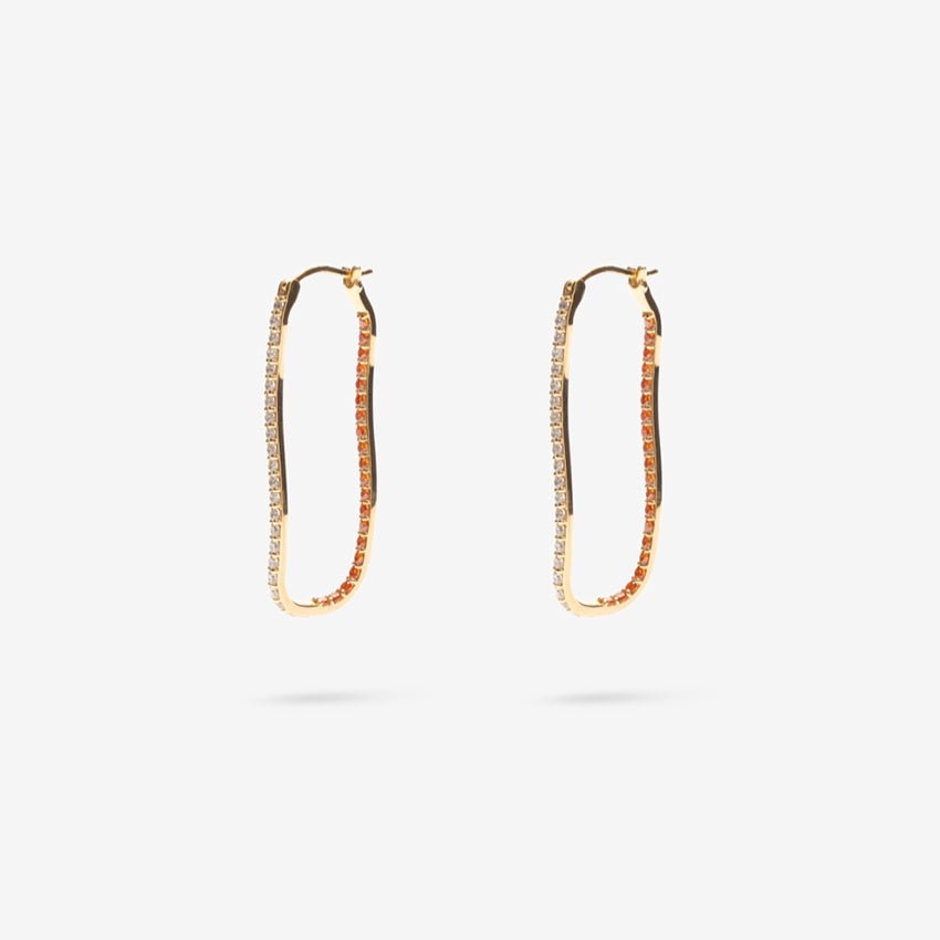 The Nina Gordon Fiasco Paved Hoops in Gold on a blank background