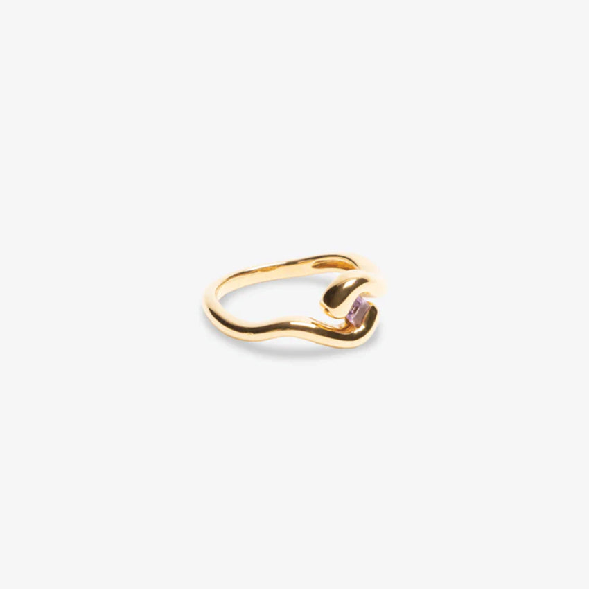 The Nina Gordon Lucid Ring with a Amethyst in Gold on a blank background