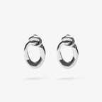 The Nina Gordon Voyage Door Knocker Earrings in Silver on a blank background