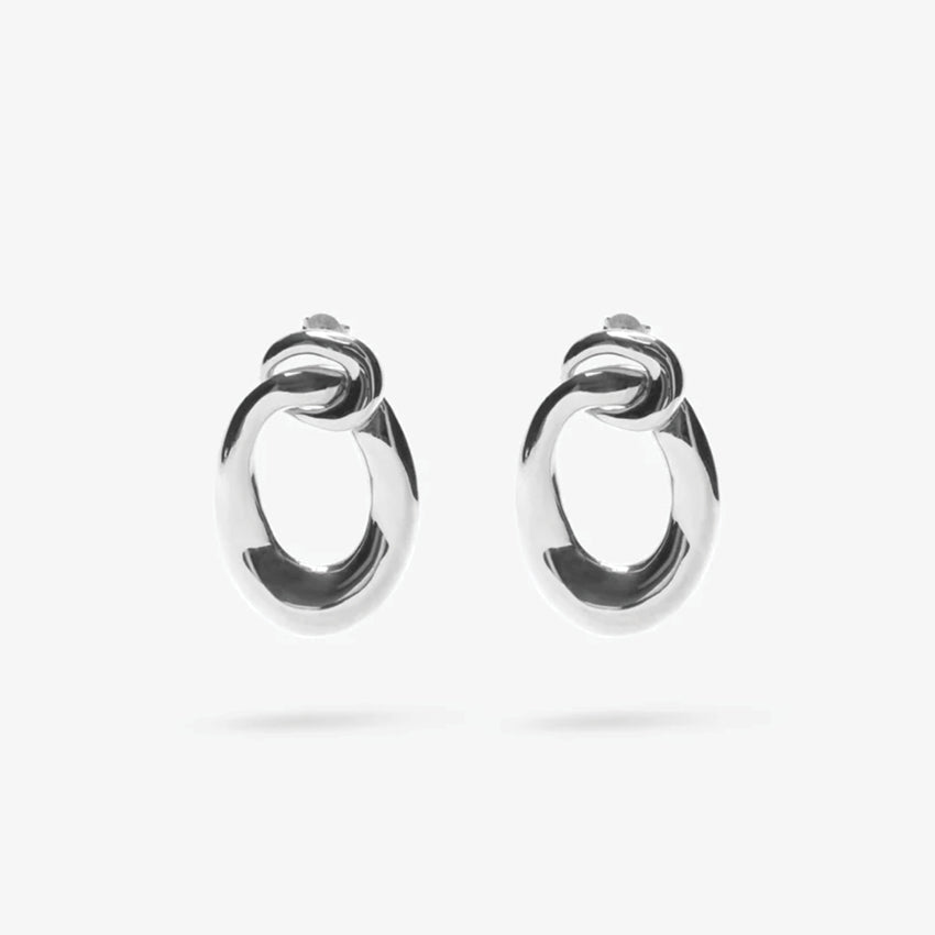 The Nina Gordon Voyage Door Knocker Earrings in Silver on a blank background