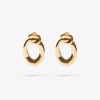 The Nina Gordon Voyage Door Knocker Earrings in Gold on a blank background