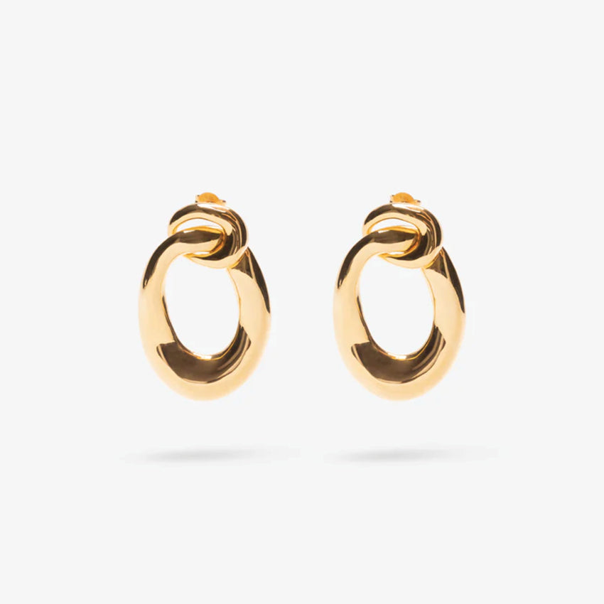 The Nina Gordon Voyage Door Knocker Earrings in Gold on a blank background