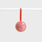 The Lettuce Ribbon Bauble hanging on a rod