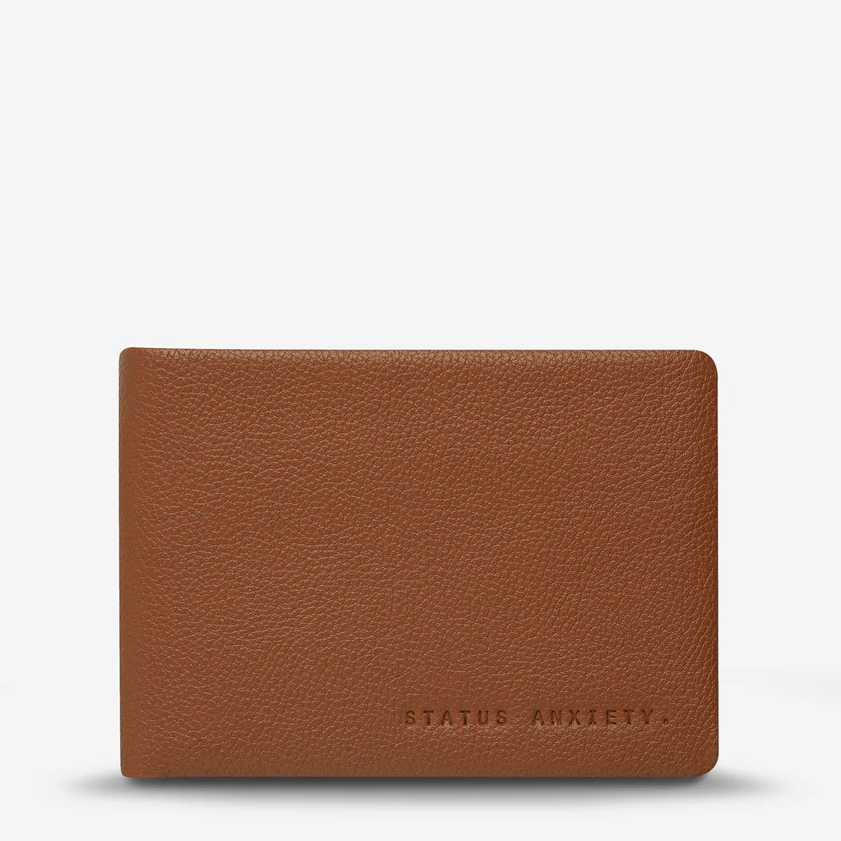 The Status Anxiety Jonah Wallet in Tan on a blank background