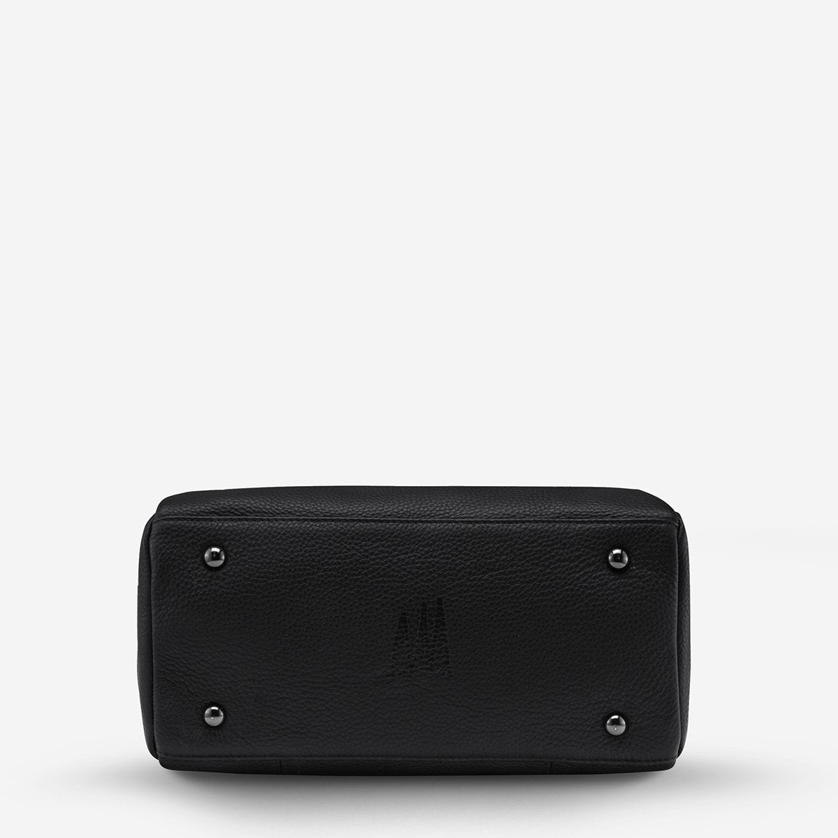 The bottom of the Status Anxiety Last Mountains Bag in Black on a blank background