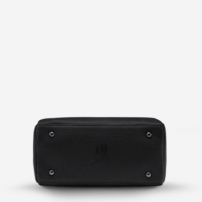 The bottom of the Status Anxiety Last Mountains Bag in Black on a blank background