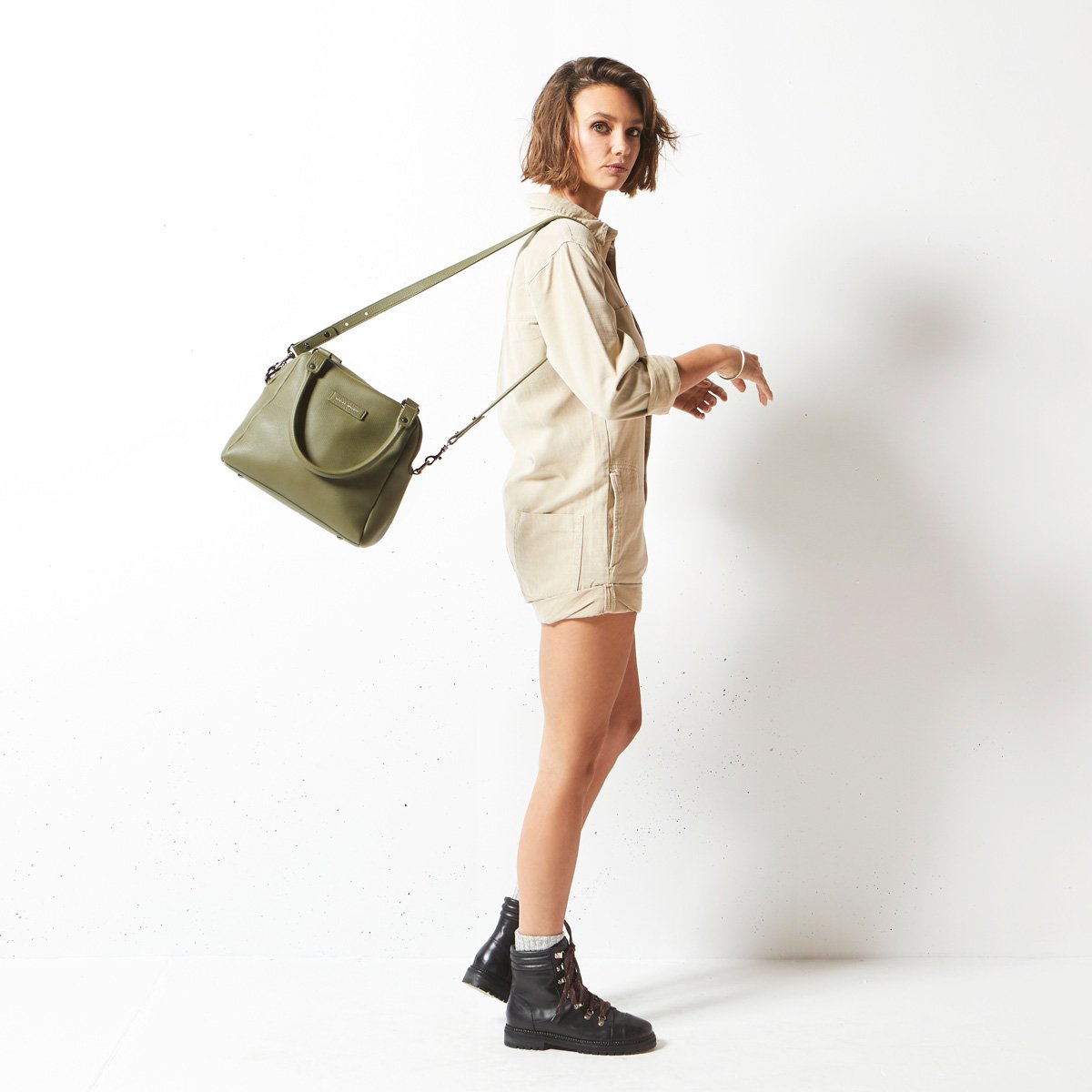 The Status Anxiety Last Mountains Bag in Khaki on a model