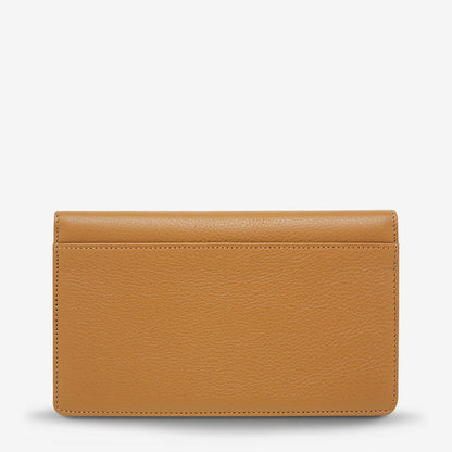 The back of the Status Anxiety Living Proof Wallet in Tan on a blank background