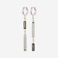 The Temple Of The Sun Pele Earrings in Sterling Silver on a blank background