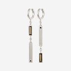 The Temple Of The Sun Pele Earrings in Sterling Silver on a blank background