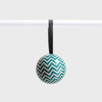 The Lettuce Zig Zag Bauble hanging on a rod