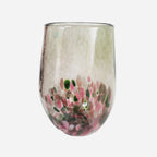 The Amokura Tumbler Glass in Bronze on a blank background
